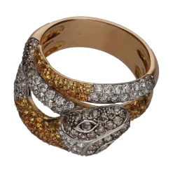 ANILLOS / SORTIJAS Sortija en forma de serpiente en oro amarillo con topacios y brillantes. Firmada por grassy. Talla 12.