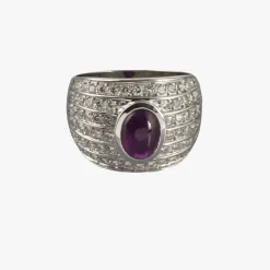 ANILLOS / SORTIJAS Sortija en oro blanco con un rubi central y motivos con brillantes dispuestos en fila