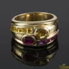 ANILLOS / SORTIJAS Sortija realizada en oro amarillo y motivos con topacios y rubíes.