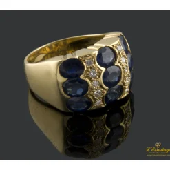 ANILLOS / SORTIJAS Sortija realizada en oro amarillo con zafiros y brillantes.