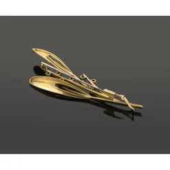 BROCHES / ALFILERES Broche-alfiler antiguo en forma de rama oro amarillo rubíes y diamantes.