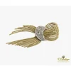 BROCHES / ALFILERES Broche-alfiler lazo con medialuna en oro amarillo y oro blanco con diamantes.