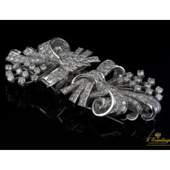 BROCHES / ALFILERES Broche doble clip en oro blanco y brillantes lazos
