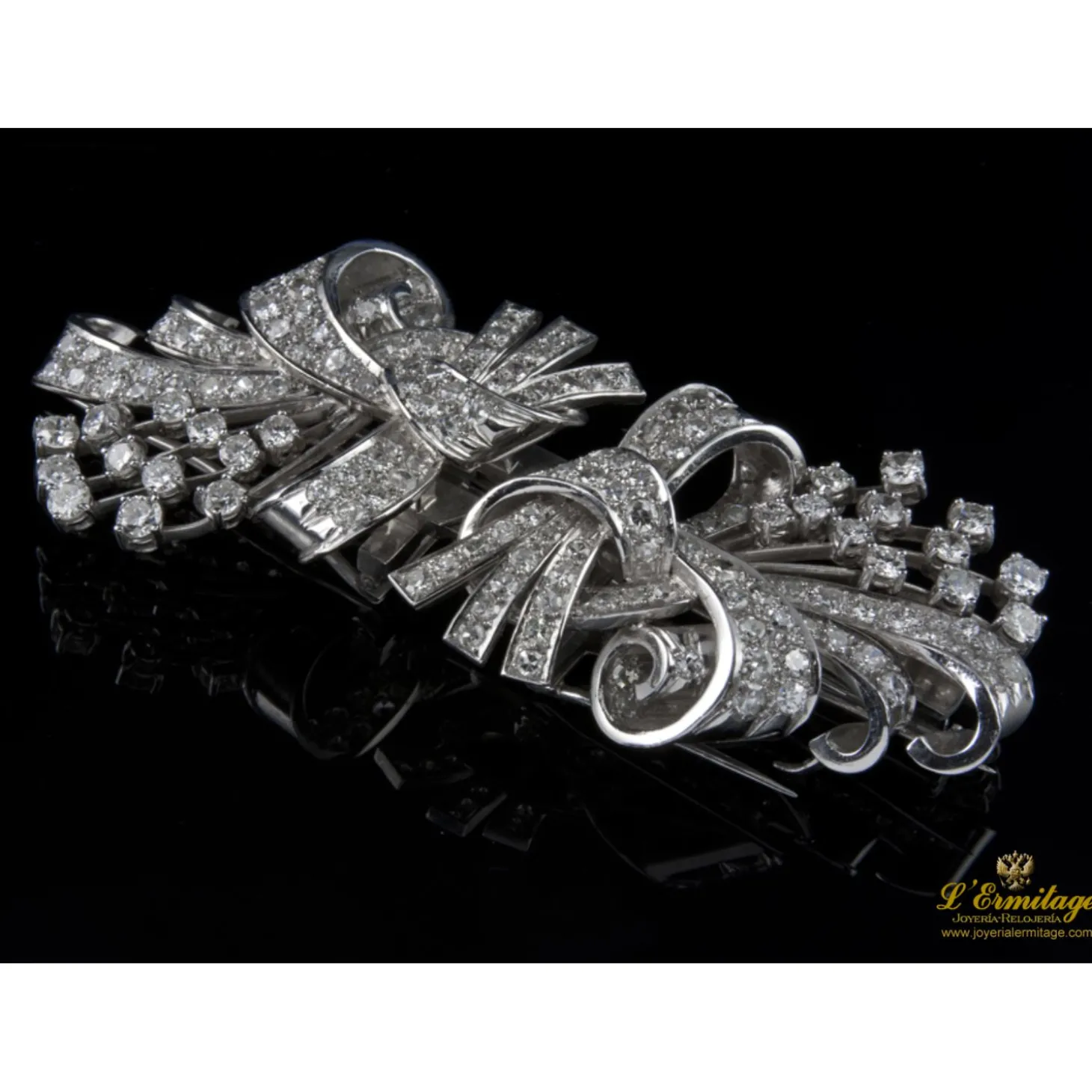 BROCHES / ALFILERES Broche doble clip en oro blanco y brillantes lazos