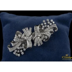 BROCHES / ALFILERES Broche doble clip en oro blanco y brillantes lazos