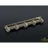 BROCHES / ALFILERES Broche en barra realizado en oro amarillo con brillantes.