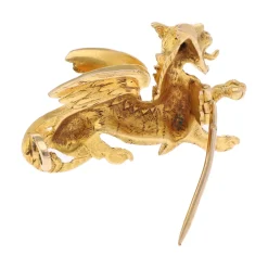 BROCHES / ALFILERES Broche en oro amarillo con forma de grifo animal mitológico.