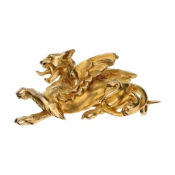 BROCHES / ALFILERES Broche en oro amarillo con forma de grifo animal mitológico.
