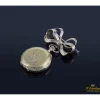 BROCHES / ALFILERES Broche reloj realizado en oro amarillo y diamantes.