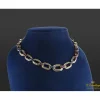 COLLARES Collar en oro amarillo con rubíes y zafiros.