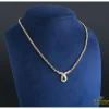 COLLARES Collar realizado en oro amarillo con un zafiro y brillantes .