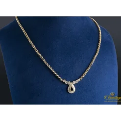 COLLARES Collar realizado en oro amarillo con un zafiro y brillantes .