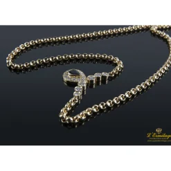 COLLARES Collar realizado en oro amarillo con un zafiro y brillantes .