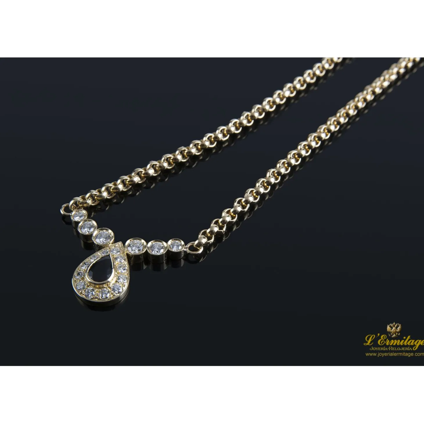 COLLARES Collar realizado en oro amarillo con un zafiro y brillantes .