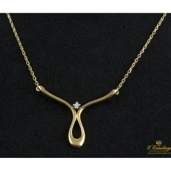 COLLARES Collar realizado en oro amarillo con un brillante.