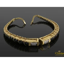 COLLARES Collar rígido realizado en oro amarillo, oro blanco, onix y brillantes.