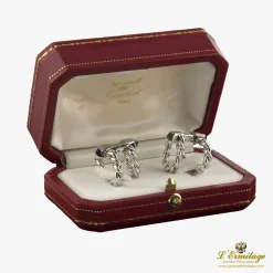 GEMELOS Gemelos cartier oro blanco trenzados.