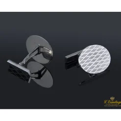 GEMELOS Gemelos realizados en oro blanco en forma oval con  grabado a rombos.