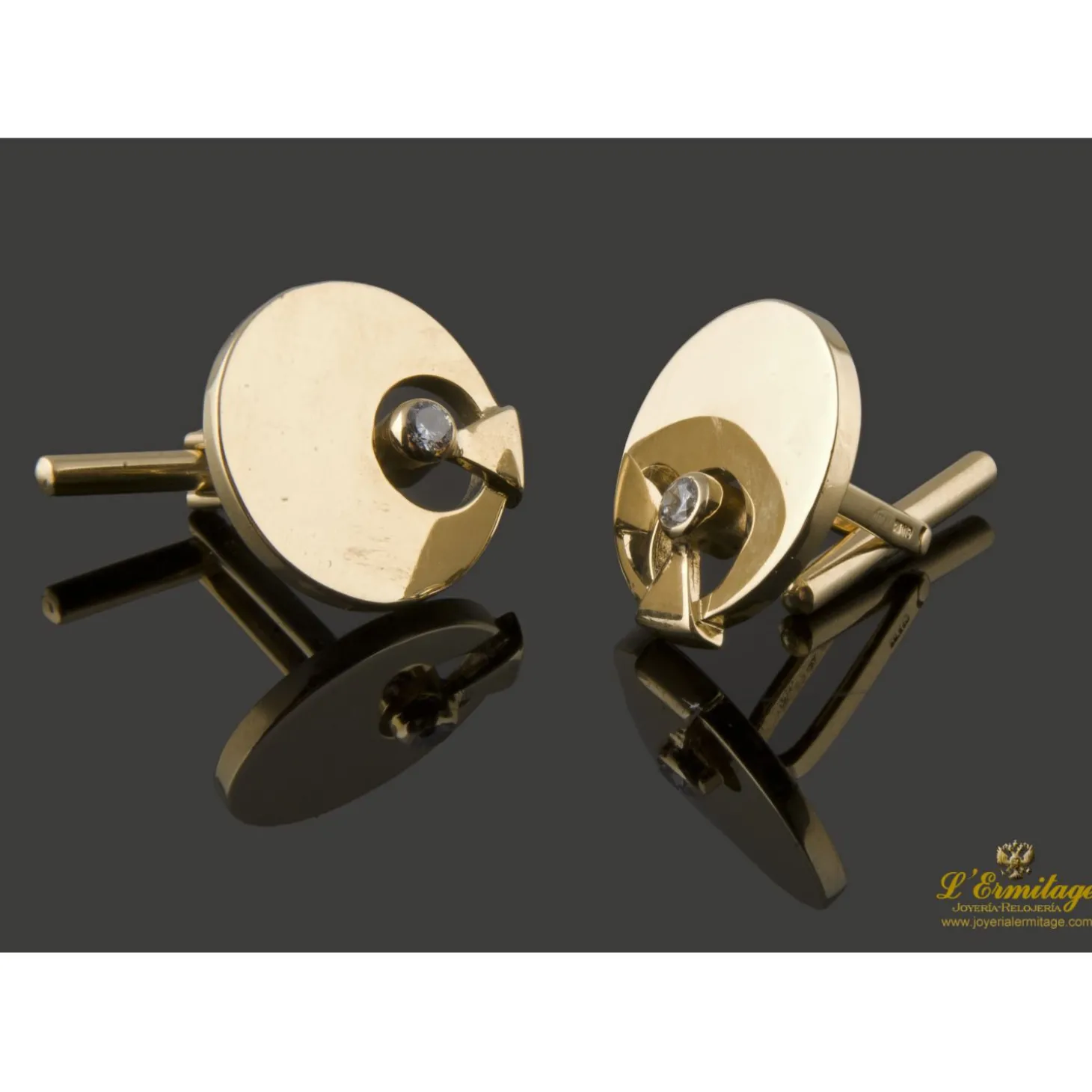 GEMELOS Gemelos redondos realizados en oro amarillo con zirconitas.