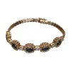 GEMELOS Pulsera en oro amarillo de 14k con zafiros y brillantes.