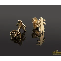 PENDIENTES Pendientes con forma de niños realizados en oro amarillo.