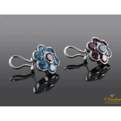 PENDIENTES Pendientes en forma de flor realizados en oro blanco. Presenta amatistas y topacios.
