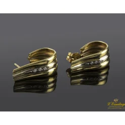 PENDIENTES Pendientes realizados en oro amarillo y oro blanco con fila de zirconitas.