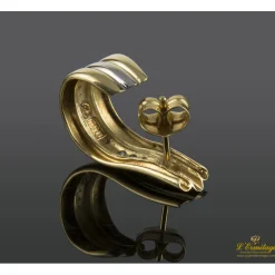 PENDIENTES Pendientes realizados en oro amarillo y oro blanco con fila de zirconitas.