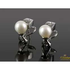 PENDIENTES Pendientes realizados en oro blanco con perlas y brillantes.