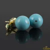 PENDIENTES Pendientes realizados en oro amarillo y bolas de turquesa.