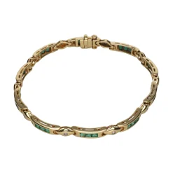 PULSERAS Pulsera en oro amarillo con esmeraldas y brillantes.