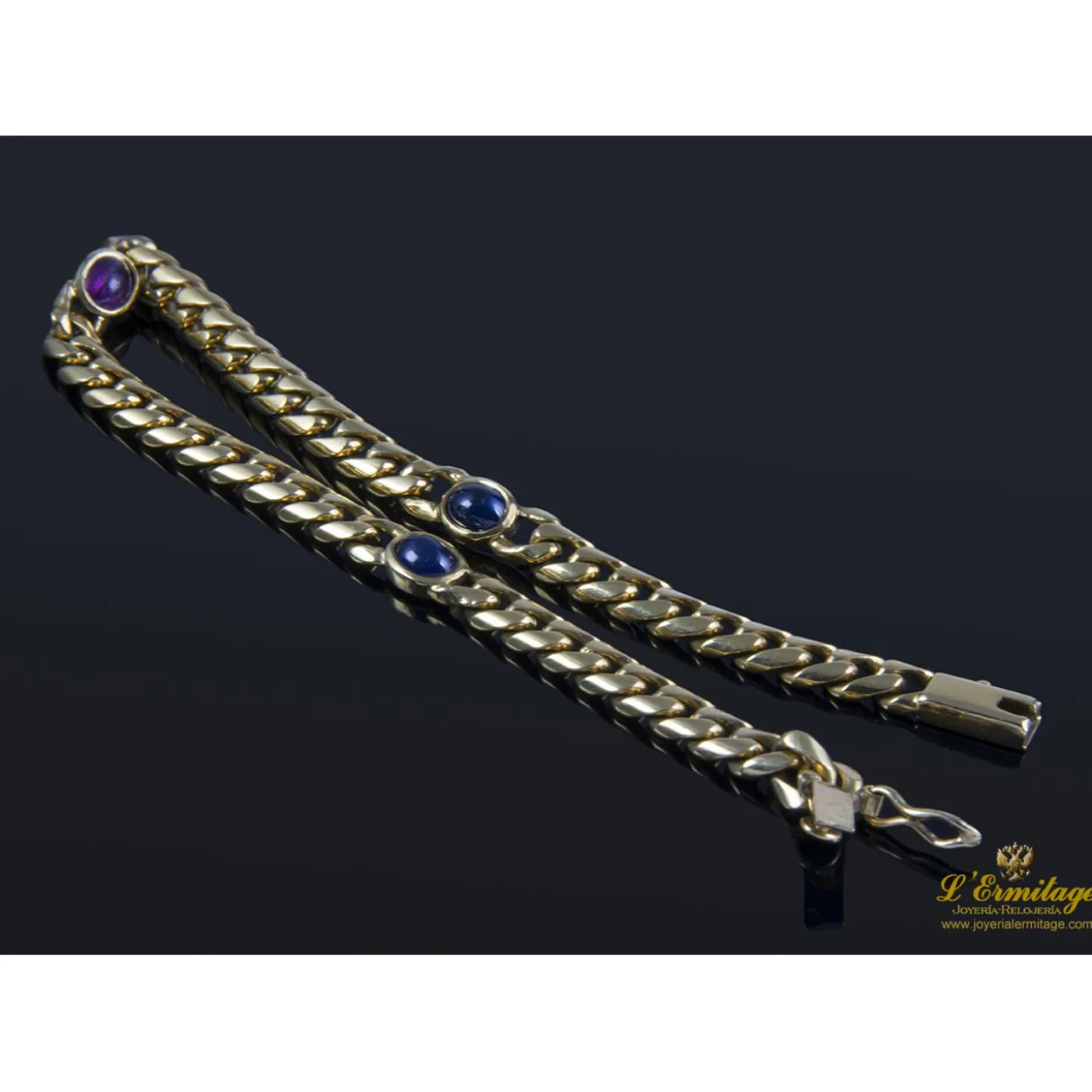 PULSERAS Pulsera en oro amarillo con rubí y zafiros