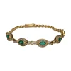 PULSERAS Pulsera en oro amarillo con esmeraldas y brillantes.