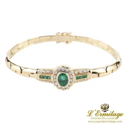 PULSERAS Pulsera en oro amarillo con esmerladas y brillantes.