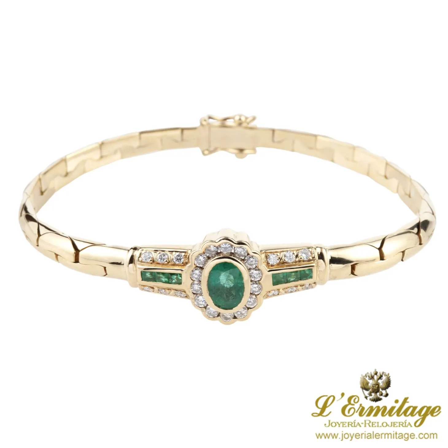 PULSERAS Pulsera en oro amarillo con esmerladas y brillantes.