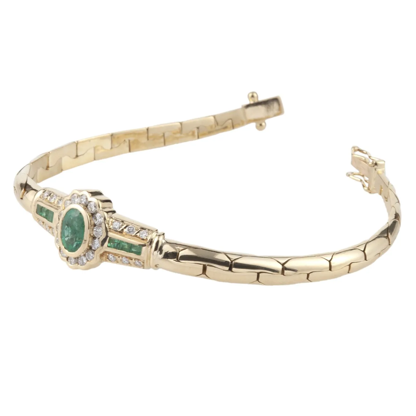 PULSERAS Pulsera en oro amarillo con esmerladas y brillantes.