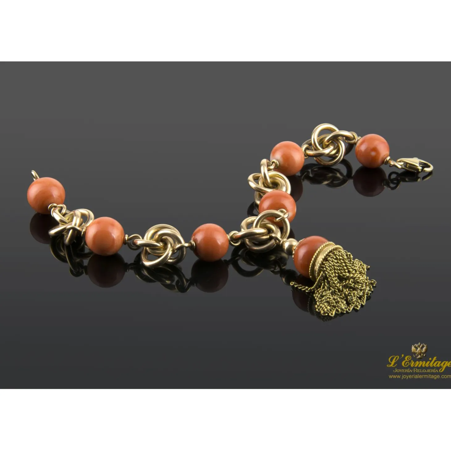 PULSERAS Pulsera en oro amarillo con bolas de coral