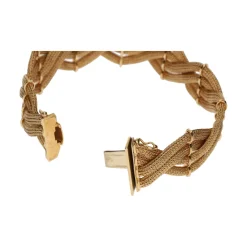 PULSERAS Pulsera en oro amarillo en forma de trenza de mallas.