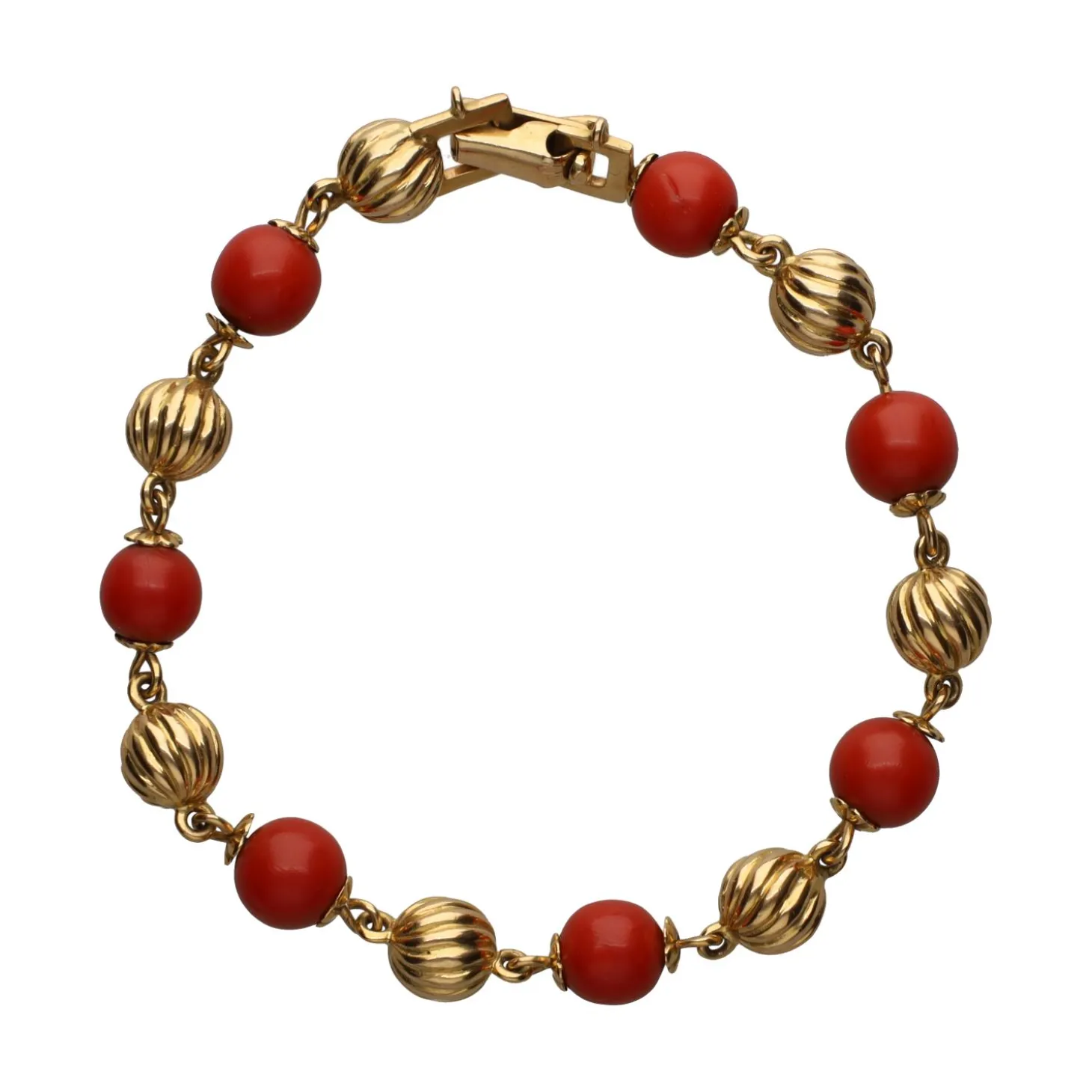 PULSERAS Pulsera en oro amarillo y coral.