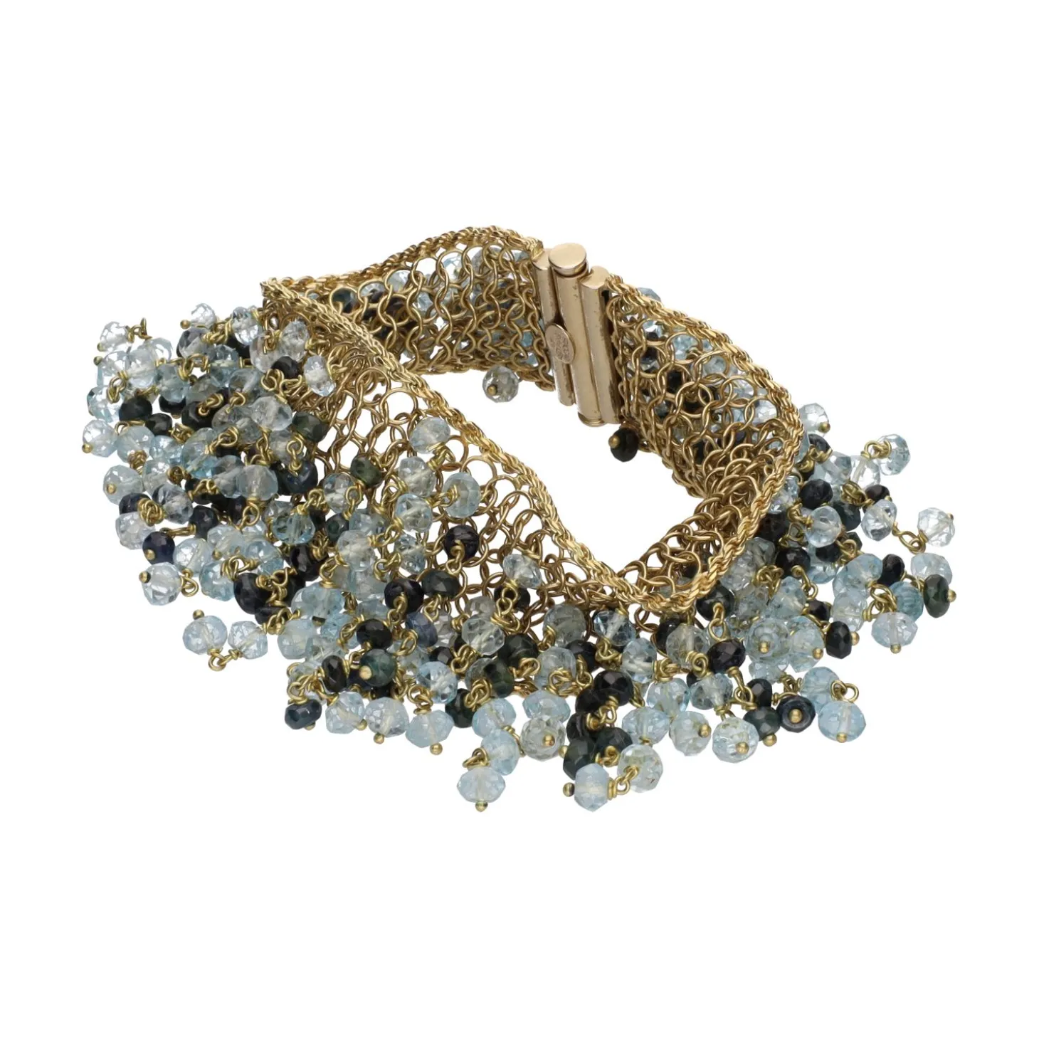 PULSERAS Pulsera en oro amarillo con bolitas de topacios y zafiros.