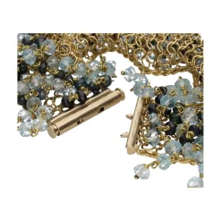 PULSERAS Pulsera en oro amarillo con bolitas de topacios y zafiros.