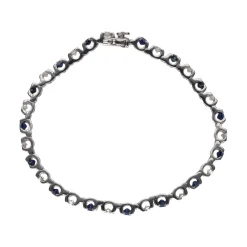 PULSERAS Pulsera en oro blanco con zafiros y brillantes.