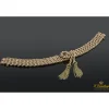 PULSERAS Pulsera realizada en oro rosa y oro amarillo con forma de cuatro trenzas en fila con un nudo y flecos.