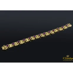 PULSERAS Pulsera realizada en oro amarillo con rubíes y brillantes.