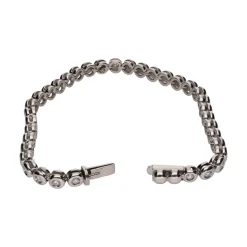 PULSERAS Pulsera riviere en oro blanco con brillantes en chatón.