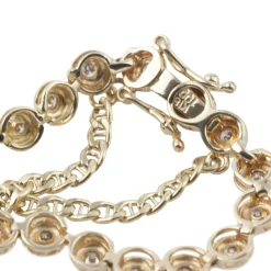 PULSERAS Pulsera riviere en oro amarillo y brillantes.