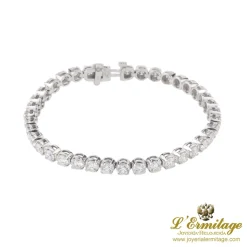 PULSERAS Pulsera riviere en oro blanco con brillantes.